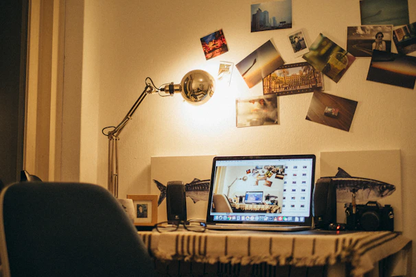 A snapshot of a cozy workspace with personal mementos and a laptop.