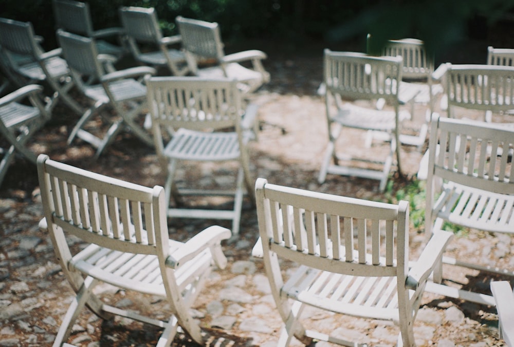 empty white wooden folding chairs