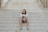 smiling man sitting on staircase