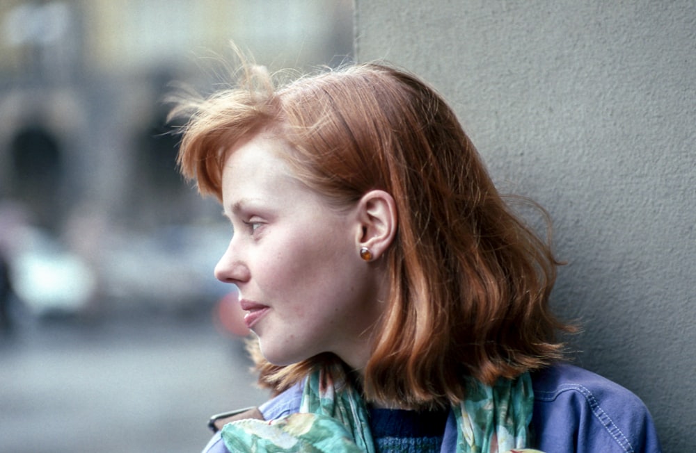 close-up photography of woman looking outside