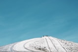 Detailed view of a ski hill topography carved in wood, showing elevation changes and trails.