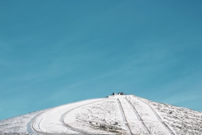 Detailed view of a ski hill topography carved in wood, showing elevation changes and trails.