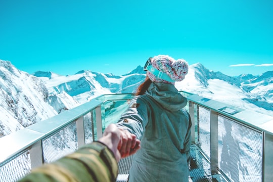 woman facing backwards near mountains in Kitzsteinhorn Austria