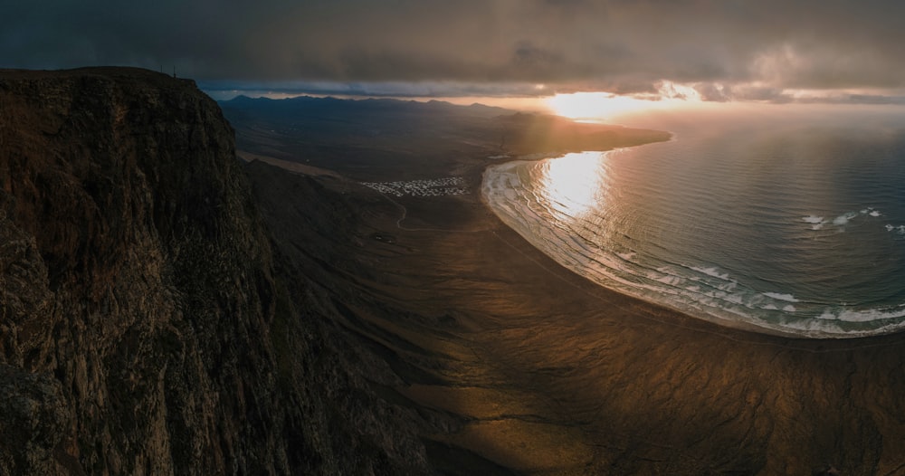 bird's eye view of seashore near cliff