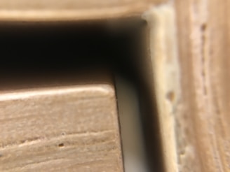 Close-up of a personalized canvas print with visible wood grain texture on the hidden pine frame edges.