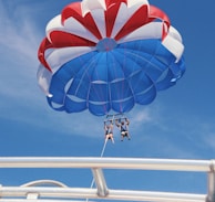 two person doing boat paragliding