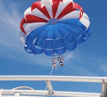 two person doing boat paragliding