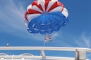 two person doing boat paragliding