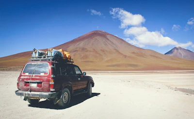 Close-up of rugged overlanding gear packed tightly on a 4x4 vehicle.