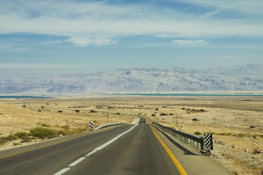 photo of black concrete road in Masada National Park Israel