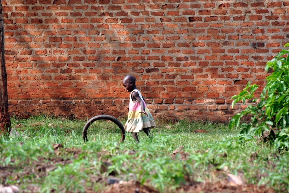 girl playing bike wheel