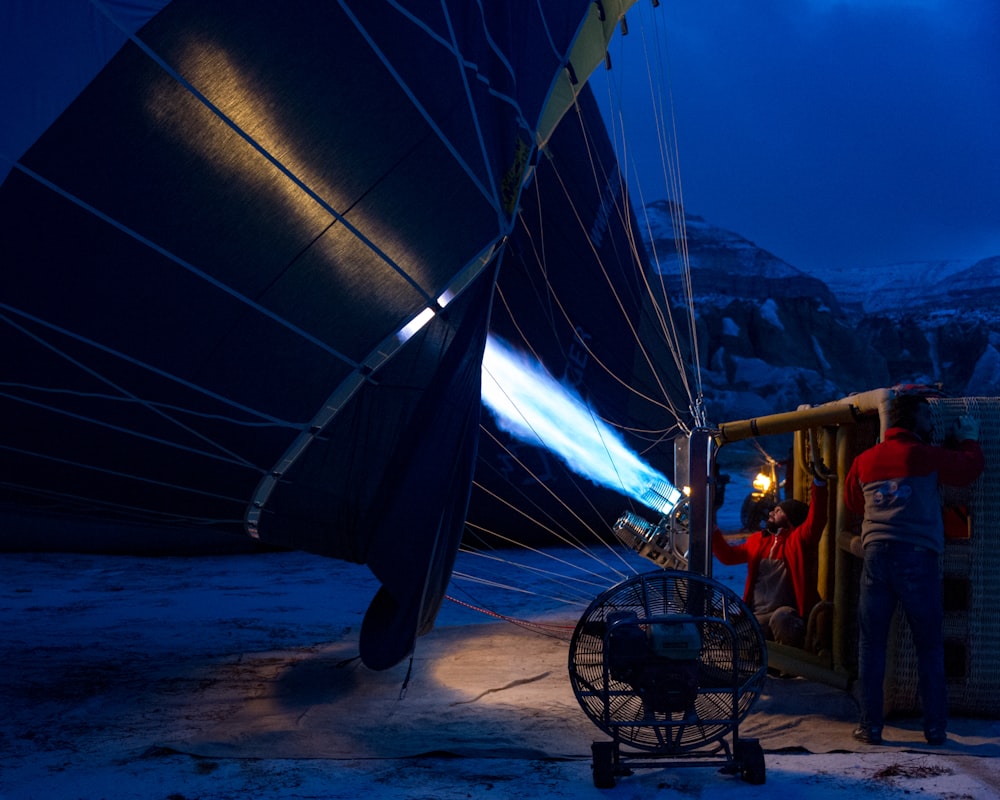 two men fixing hot air balloon