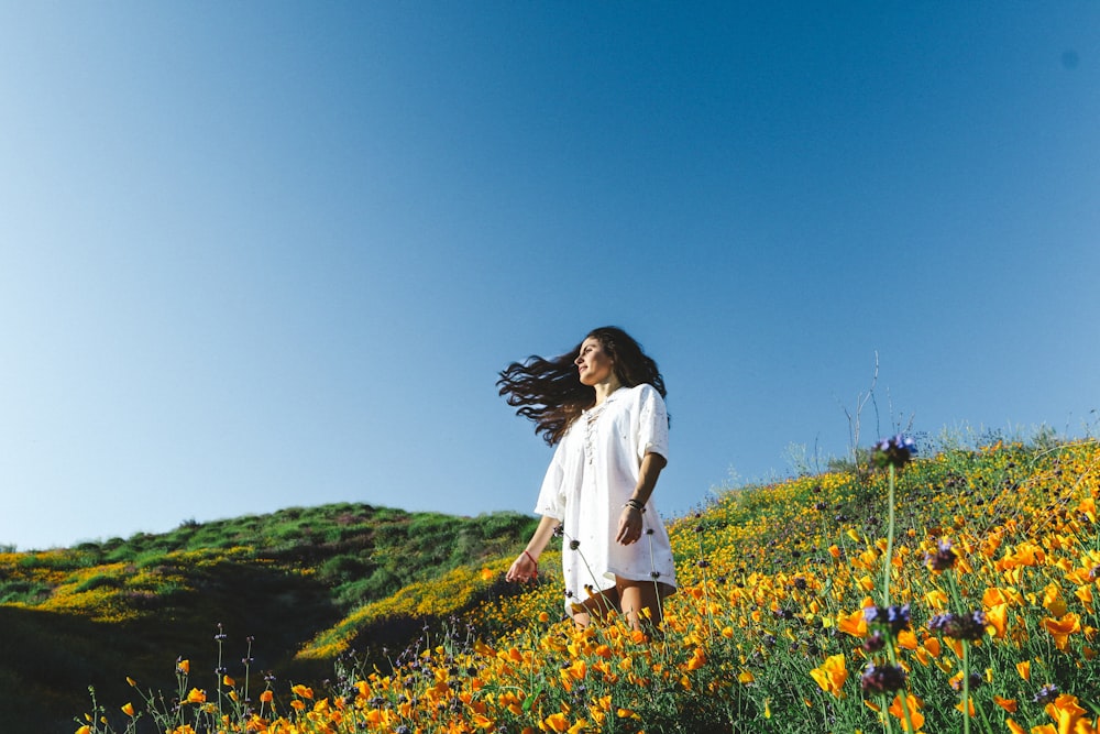 woman standing of flower field