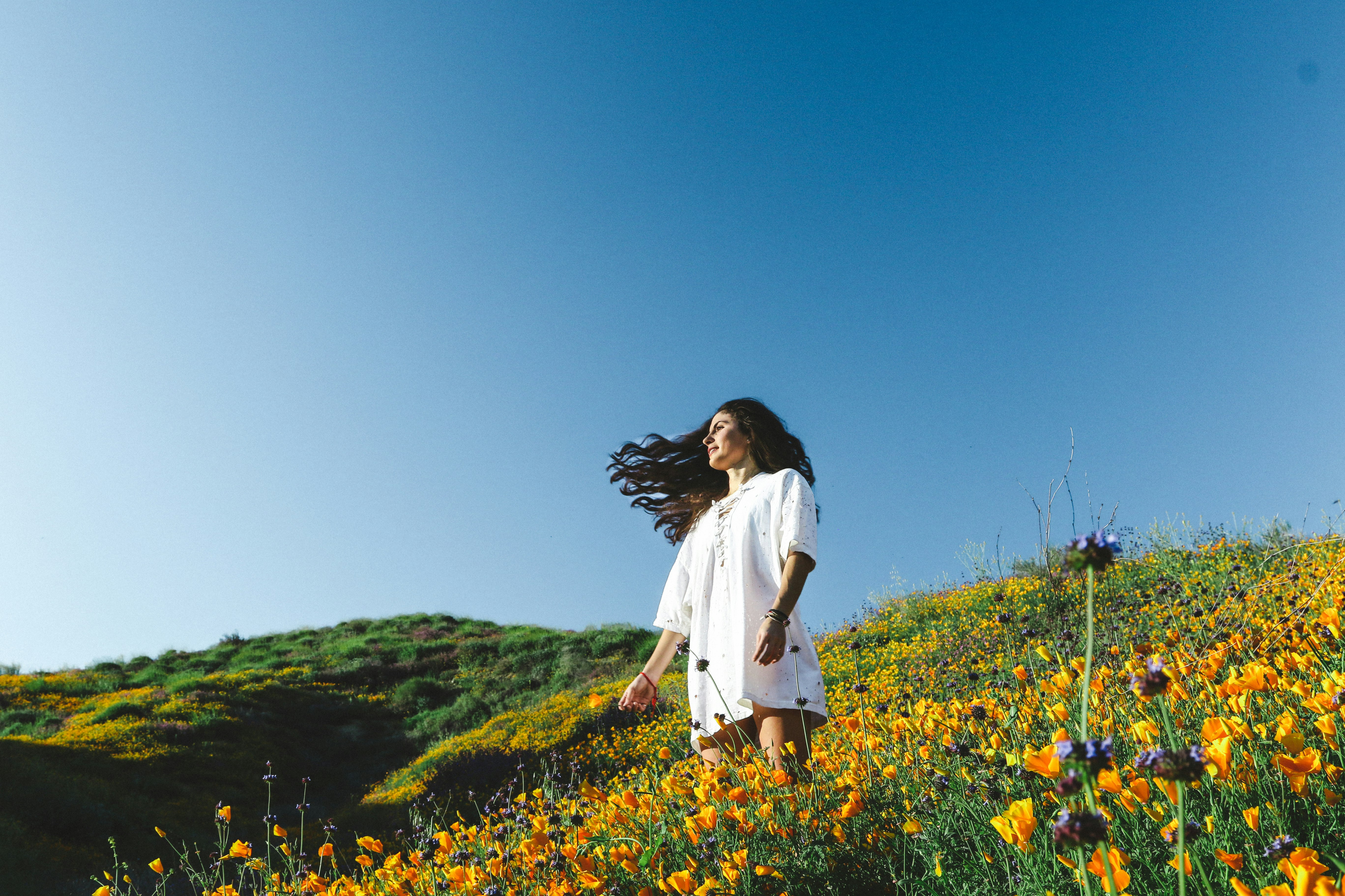 woman standing of flower field