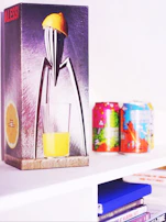 Elegant packaging of Lucifora preserves displayed with fresh Sicilian lemons.