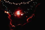 Ambient lighting casting a warm glow over a small gathering with thematic decorations.