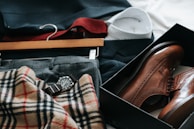 pair of brown leather dress shoes with box