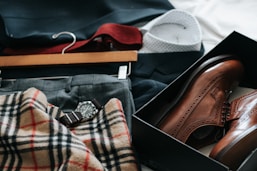 pair of brown leather dress shoes with box