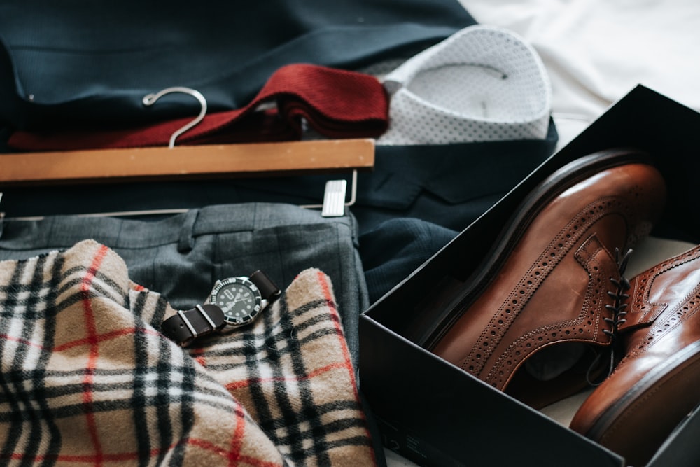 pair of brown leather dress shoes with box