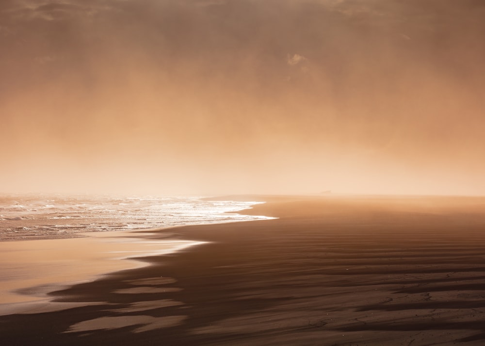 body of water across sands