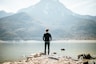 man standing on front of lake at daytime