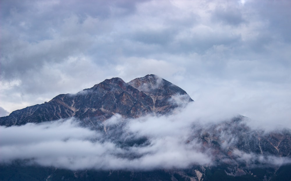 mountain covered by clouds