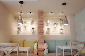 Room seating area with colorful cushions and a small table
