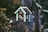 closeup photo of red and white bird house