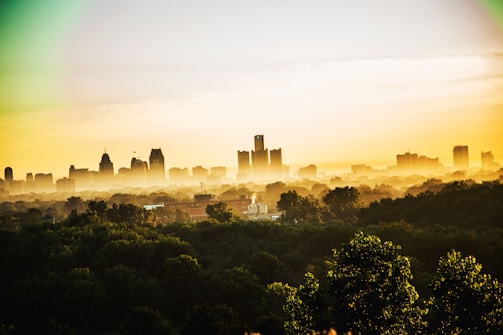 A sunrise over a cityscape intertwined with lush greenery symbolizing harmony between nature and technology.