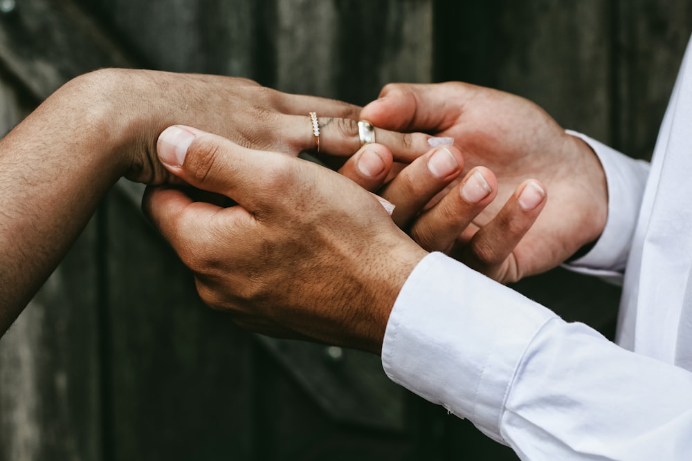 man holding person's hands