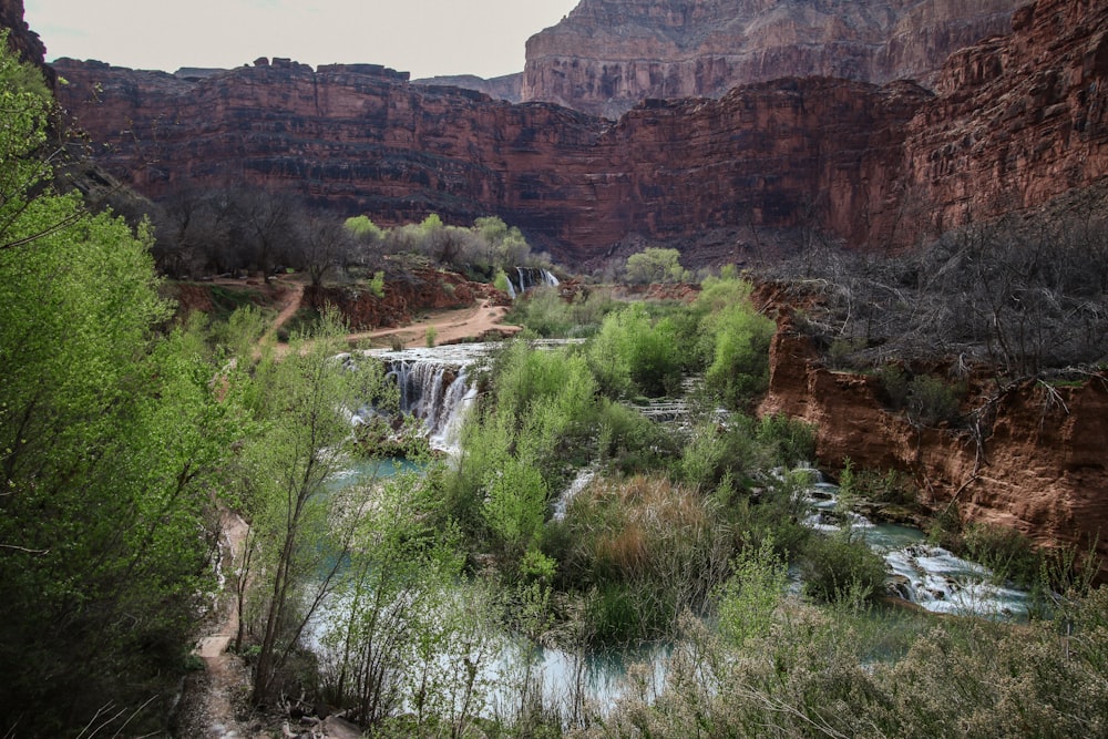 body of water beside cliff