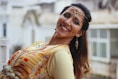 woman leaning while smiling