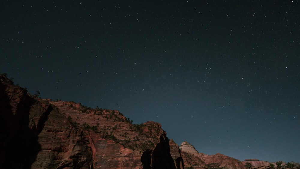 low-light photo of rock formation