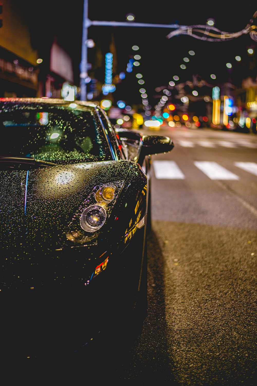 close photography of black convertible on road