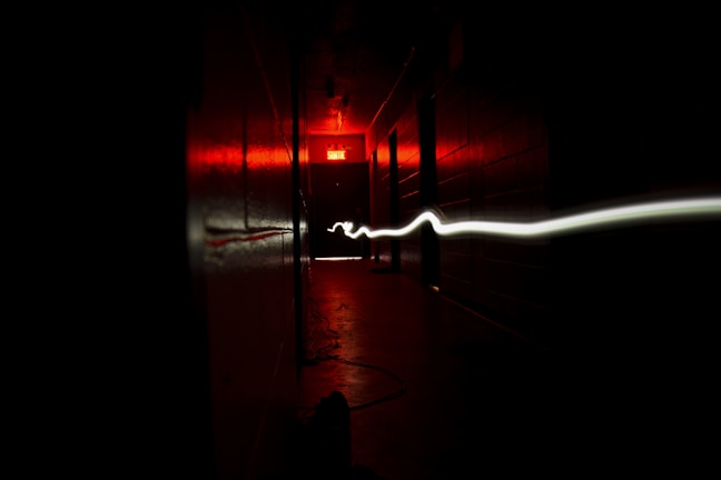 Motion-reactive lighting illuminating a hallway with dynamic waves of light.