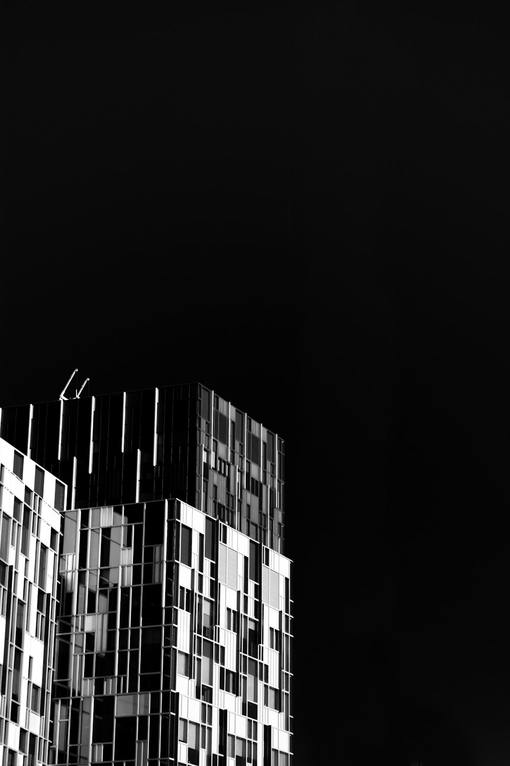 a black and white photo of a tall building