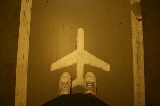 A map highlighting global delivery routes with a pair of stylish shoes at the center.