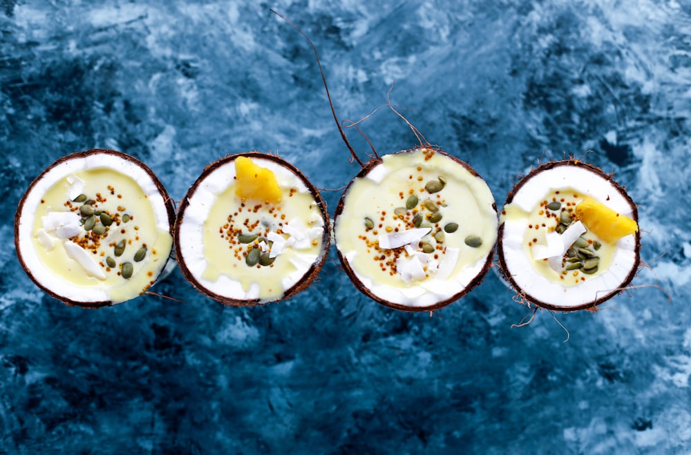flat-lay photography of four coconut desserts