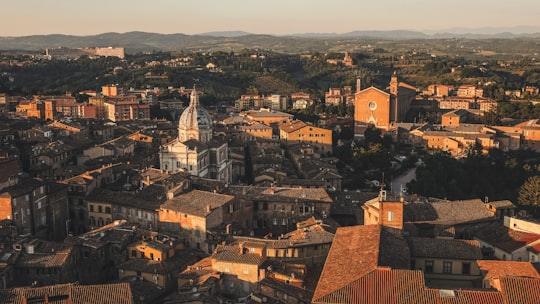 Beautiful aerial view by a drone of Siena, Italy. Charming old buildings showcase western Europe's architecture. in Siena Italy