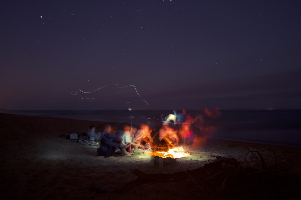group of people making bonfire