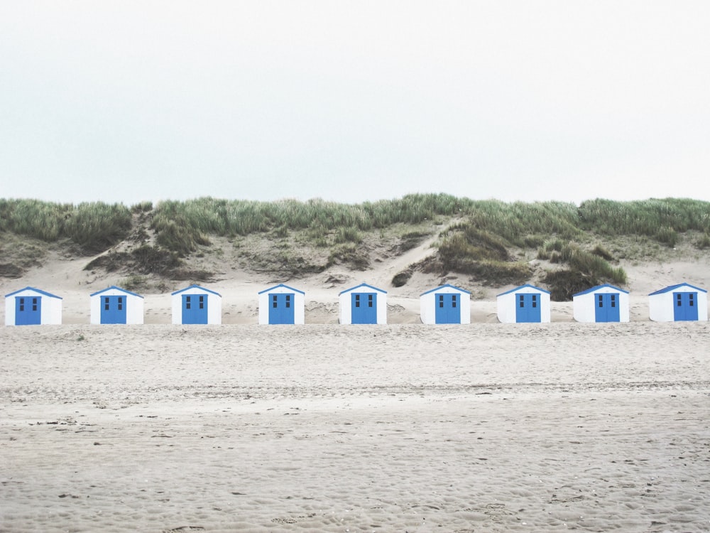 white and blue cabins in the middle of the desert