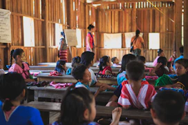 group of toddlers on the school with teacher teaching