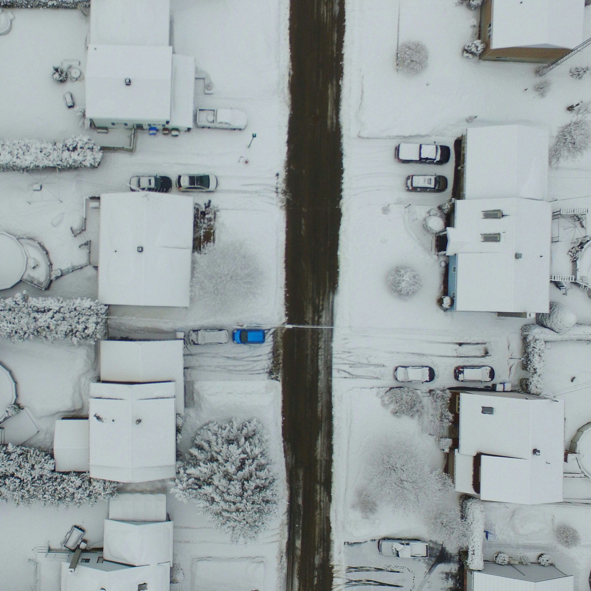 birds eye photography of snow covered residential area