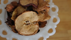 A stylish bowl filled with colorful dried fruits, perfect for healthy gifts.