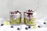 Refreshing frozen yogurt topped with kiwi slices and a sprinkle of chia seeds.