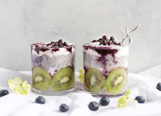 two fruit beverages on glass cups