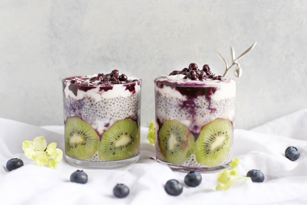 two fruit beverages on glass cups