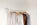 assorted clothes in wooden hangers