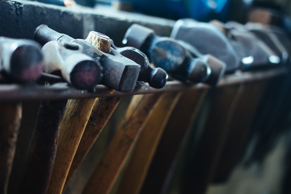 selective focus photo of black-and-brown ball-peen hammers