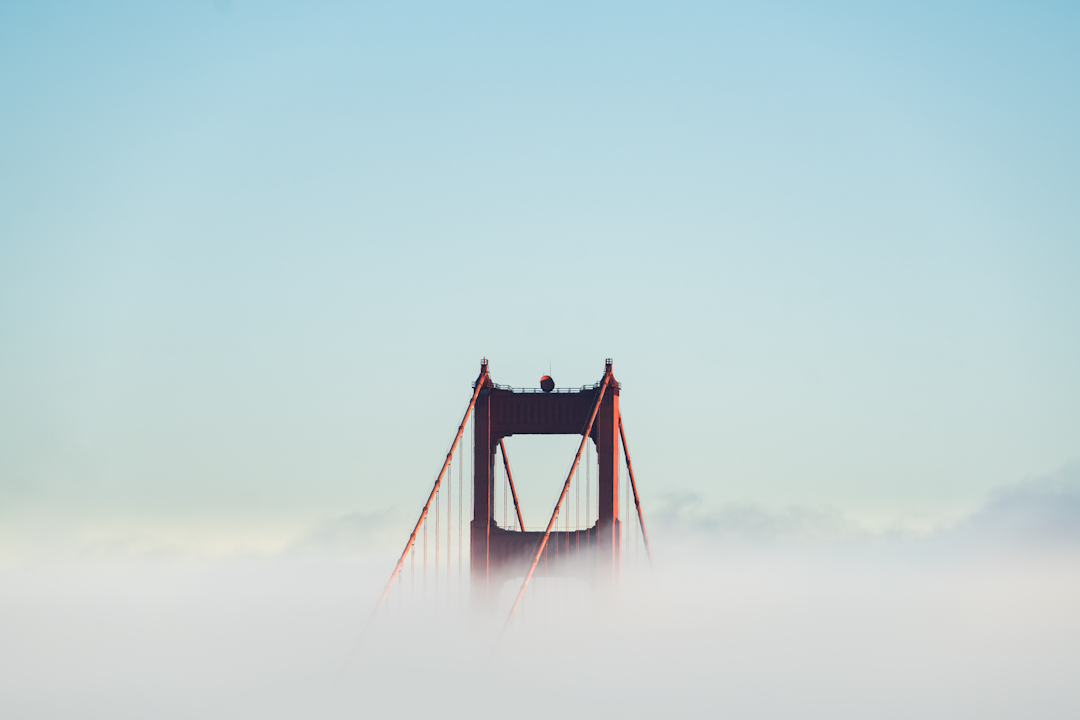 red concrete bridge surrounded by clouds, Rise above. Show the world what you’re made of. Show the world you are special